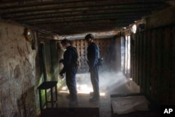 FILE - In this photo made available by the U.S. Coast Guard, guardsmen from the cutter James conduct a boarding of a fishing vessel in the eastern Pacific Ocean, on Aug. 4, 2022.