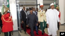FILE - Nigeria's President Muhammadu Buhari leaves the State House after a presentation to the National Assembly in Abuja, Nigeria, Oct. 7, 2022.