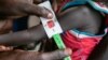 In this photo released by the World Food Programme (WFP) on Nov. 3, 2022, a woman is screened for malnutrition at a Nyong Primary Health Care Unit nutrition site in South Sudan where the WFP is offering supplementary feeding to children, pregnant and lactating women. 