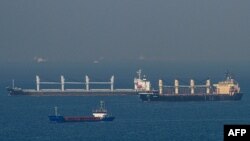 FILE - Cargo ship Rubymar, right, carrying Ukrainian grain, and cargo ship Stella GS, background-left, originating from Ukraine, sail at the entrance of the Bosphorus in the Black Sea off the coast off Kumkoy, north of Istanbul, Turkey, Nov. 2, 2022. 