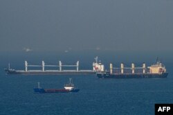 FILE - Cargo ship Rubymar (R), carrying Ukrainian grain, and cargo ship Stella GS (L) originating from Ukraine, sail at the entrance of Bosphorus, in the Black Sea off the coast off Kumkoy, north of Istanbul, Nov. 2, 2022.