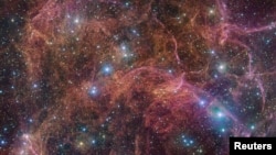 An undated image shows a view of the orange and pink clouds that make up what remains after the explosive death of a massive star - the Vela supernova remnant. (ESO/VPHAS+ team/Cambridge Astronomical Survey Unit/Handout via REUTERS )