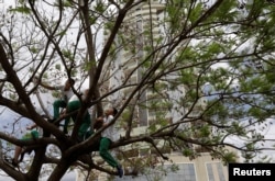 Children play in front of the upscale residential building Bella Vita, recently constructed in Luis Eduardo Magalhaes, Bahia state, Brazil September 12, 2018. Picture taken September 12,2018. REUTERS/Ricardo Moraes