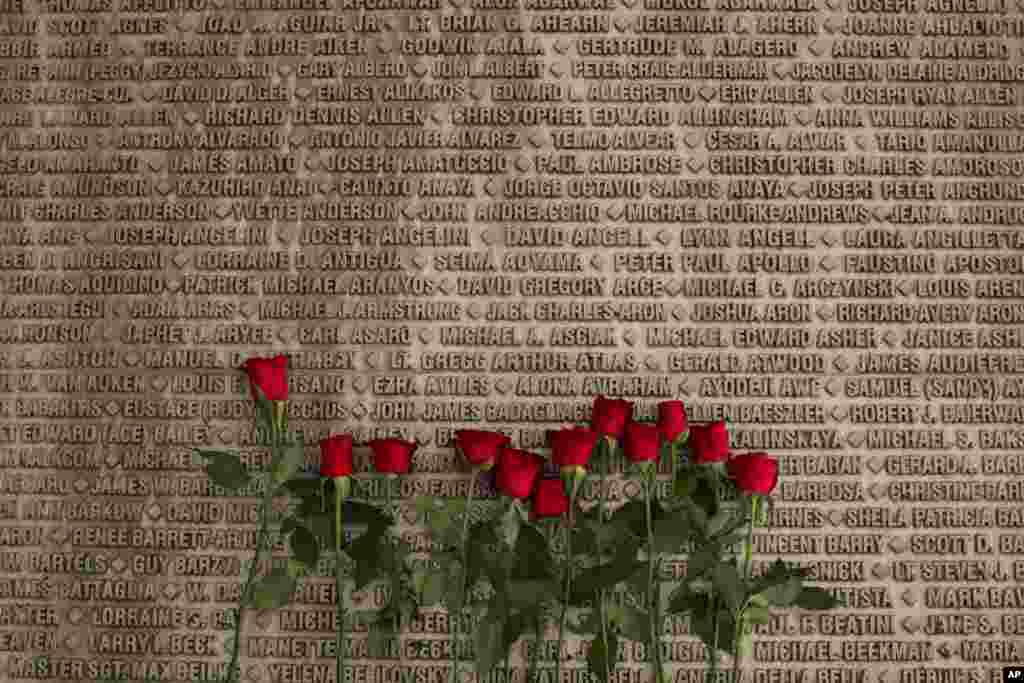 Red roses are placed next to names of victims of the Sept. 11, 2001 terrorist attacks on the U.S. at a memorial site during a ceremony marking the 12th anniversary of 9/11 outside Jerusalem, Sept. 11, 2013.&nbsp;