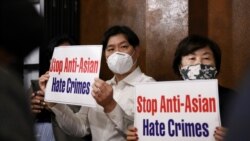 Members of the Atlanta Korean American Committee against Asian Hate Crime show placards as they meet at Ching Dam, a Korean restaurant, after the fatal shooting at three Georgia spas, in Duluth, Georgia, U.S., March 18, 2021