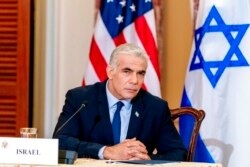 Israeli Foreign Minister Yair Lapid attends a news conference at the State Department in Washington, Oct. 13, 2021.