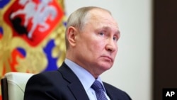 Russian President Vladimir Putin attends a cabinet meeting via videoconference at the Novo-Ogaryovo state residence outside Moscow, Russia, April 19, 2023. 