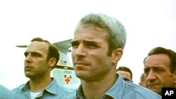 This still from video obtained exclusively by Associated Press shows then-prisoner of war John McCain, standing with other POWs as they were released by the North Vietnamese in Hanoi on March 14, 1973.