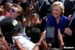 U.S. Democratic presidential nominee Hillary Clinton greets voters outside of an early voting site in Lauderhill, Florida, November 2, 2016.