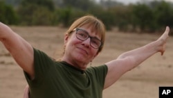 This photo provided by Craig Manders shows his wife, Lisa, in Zambia in mid-2024. Lisa Manders was killed in a hippopotamus attack during this trip while on a safari with her husband and died on June 5.