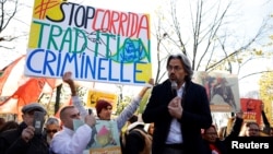Member of parliament Aymeric Caron of the French far-left opposition party La France Insoumise at an anti-bullfighting protest in Paris, France, November 24, 2022. The sign reads "Stop Corrida. Criminal tradition". (REUTERS/Sarah Meyssonnier)