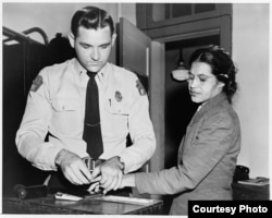 Mrs. Rosa Parks (being fingerprinted), Negro seamstress, whose refusal to move to the back of a bus touched off the bus boycott in Montgomery, Alabama." 1956. New York World-Telegram & Sun Collection, Prints and Photographs Division, Library of Congress.
