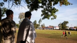 Members of the U.S. military and Afghan refugees play soccer at the Fort McCoy U.S. Army base, Sept. 30, 2021, in Fort McCoy, Wis. The fort is one of eight military installations across the country that are temporarily housing Afghans who fled their homeland after the U.S. troop withdrawal.
