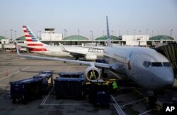 In this June 16, 2018 photo, American Airlines jets are shown at O"Hare International Airport in Chicago.