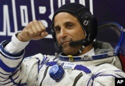 U.S. astronaut Joseph Acaba, crew member of the mission to the International Space Station, gestures prior the launch of Soyuz-FG rocket, Sept. 12, 2017.