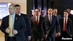 U.S. Treasury Secretary Steven Mnuchin (C) and the U.S. delegation for trade talks with China, leave a hotel in Beijing, China May 3, 2018. Talks between U.S. and Chinese officials have not yet restarted.