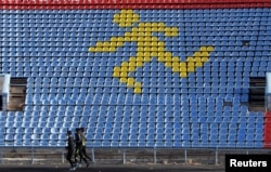 FILE - Athletes train at a local stadium in the southern city of Stavropol, Russia, Nov. 10, 2015. Russia's Track and Field Association was provisionally suspended from international competition in November following a condemning report by the World Anti-Doping Association.