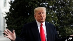 President Donald Trump talks to the media on his way to the Marine One helicopter, Nov. 20, 2019, as he leaves the White House in Washington, en route to Texas.