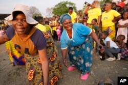 Women in support of the Gule Wamkulu secretive society dance in Harare, Zimbabwe, Oct. 23, 2022.