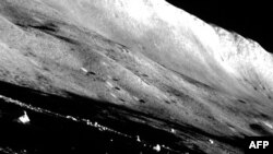 This handout photo released on Feb.1, 2024 from the Japan Aerospace Exploration Agency (JAXA) shows the last scene of the Moon taken by the Smart Lander for Investigating Moon (SLIM) with its navigation camera before dusk.