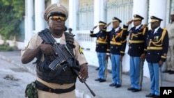 Soldiers of the Haitian Armed Forces stands guard during a ceremony to mark the anniversary of the Battle of Vertieres, the last major battle for Haiti's independence from France, at Army headquarters in Port-au-Prince, Haiti, Nov. 18, 2022.