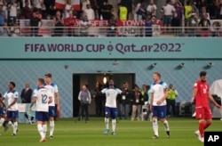 England's Bukayo Saka, center, celebrates after scoring his team's fourth goal during the World Cup group B soccer match between England and Iran at the Khalifa International Stadium in Doha, Qatar, Nov. 21, 2022.