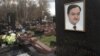caption: A tombstone on the grave of lawyer Sergei Magnitsky, who died in jail, at a cemetery in Moscow, November 16, 2012.