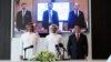 QatarEnergy CEO and Qatar's Minister of Energy Saad al-Kaabi, bottom row center, stands at a signing ceremony with Sinopec, in Doha, Qatar, Nov. 21, 2022.