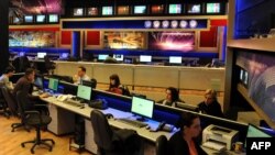 FILE - Editors of Rustavi 2 work in the television channel's headquarters in Tbilisi, March 12, 2012. A reported plot to assassinate journalist Giorgi Gabunia for comments he made while working for Rustavi 2 was foiled earlier this month. 