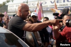 A supporter of Brazil’s President Jair Bolsonaro is seen injured after clashing with former president and presidential candidate Luiz Inacio Lula da Silva's supporters in Sao Goncalo in Rio de Janeiro state, Brazil, Sept. 9, 2022.