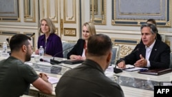 FILE - U.S. Secretary of State Antony Blinken, right, meets with Ukrainian President Volodymyr Zelenskyy, left, in Kyiv, Sept. 8, 2022.