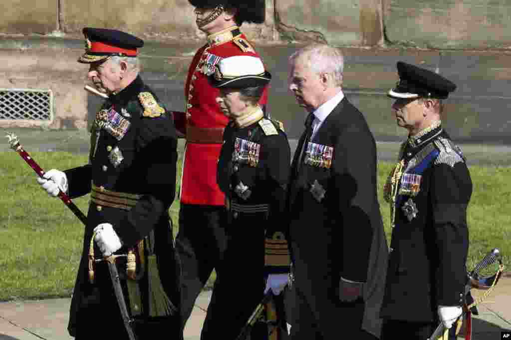 King Charles III, the Princess Royal, the Duke of York and the Earl of Wessex walk behind the hearse carrying the coffin of Britain's Queen Elizabeth II, in Edinburgh, Scotland, Sept. 12, 2022.