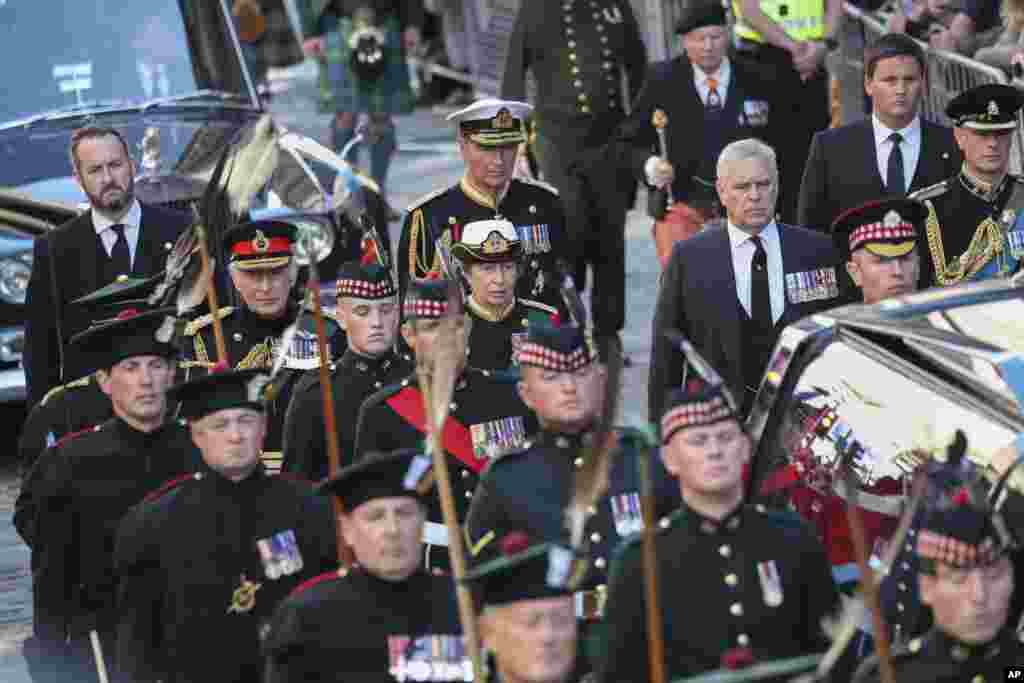 King Charles III, the Princess Royal, the Duke of York and the Earl of Wessex walk behind the hearse carrying the coffin of Queen Elizabeth II, in Edinburgh, heading up the Royal Mile to St. Giles&#39; Cathedral, Sept. 12, 2022.