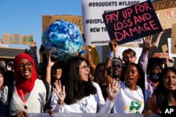 Activists take part in a protest at the COP27 U.N. Climate Summit, in Sharm el-Sheikh, Egypt, Nov. 18, 2022. (AP Photo/Peter Dejong)