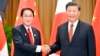 Japanese Prime Minister Fumio Kishida, left, and Chinese President Xi Jinping shake hands during their meeting on the sidelines of the Asia-Pacific Economic Cooperation forum, Nov. 17, 2022, in Bangkok.