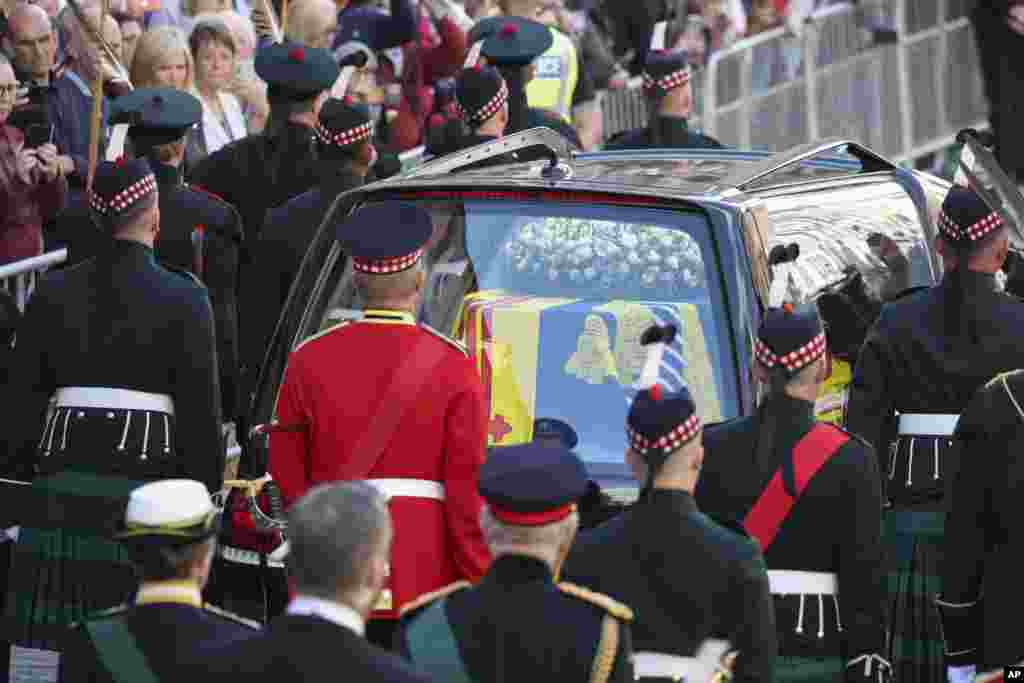 The procession with the coffin of Queen Elizabeth II, followed by King Charles III, Princess Anne, Prince Edward and Prince Andrew, heads up the Royal Mile to St. Giles&#39; Cathedral in Edinburgh, Sept. 12, 2022.
