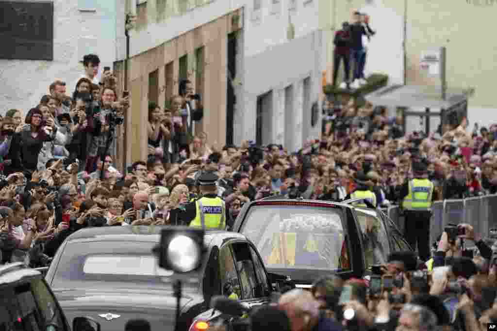 The hearse carrying the coffin of Queen Elizabeth II, draped with the Royal Standard of Scotland, passes along Canongate towards the Royal Mile as it completes its journey from Balmoral to the Palace of Holyroodhouse in Edinburgh, where it will lie in res