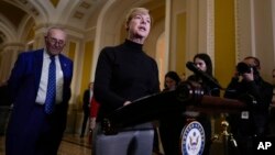 Democratic Senator Tammy Baldwin, at podium, joins Senate Democratic Majority Leader Chuck Schumer to talk about Democrats' efforts to pass the Respect for Marriage Act, at the Capitol in Washington, Nov. 15, 2022. The Senate advanced the bill 62-37 on Nov. 17.