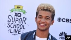 FILE - Jordan Fisher arrives at the EIF Presents: XQ Super School Live on Friday, Sept. 8, 2017 in Santa Monica, Calif. 