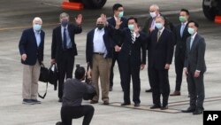 From left, former U.S. senator Chris Dodd, former U.S. Deputies Secretary of State James Steinberg and Richard Armitage have their photo taken with Taiwan Foreign Minister Joseph Wu upon arrival in Taipei, Taiwan on Wednesday, April 14, 2021. (Pool Photo via AP)