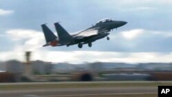 Južnokorejski borbeni avion američke proizvodnje, F15K, polijeće iz baze na nedefinisanoj lokaciji u Sjevernoj Koreji, 4. oktobra 2022.