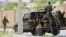 FILE - Somali soldiers are seen riding on a pickup truck in Mogadishu, Somalia, April 27, 2022. 