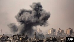 This image taken from the Israeli border with the Gaza Strip on Oct. 29, 2023, shows a black cloud of smoke ascending from the Gaza Strip amid the ongoing battles between Israel and the Palestinian group Hamas. 