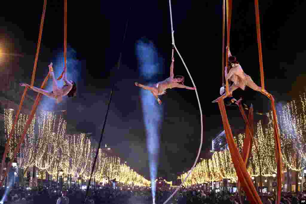 Dancers perform during a New Year's celebration on the Champs Elysees in Paris, France, Dec. 31, 2023.