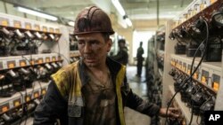 A miner leaves his lantern after his duty at the coal mine in Dnipropetrovsk region, Ukraine, April 7, 2023.