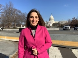 FILE - In this undated VOA photo, VOA journalist Cristina Caicedo Smit poses near the U.S. Capitol in Washington.