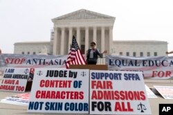 A person protests outside of the Supreme Court in Washington, June 29, 2023.