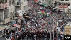 រូបឯកសារ៖ ក្រុម​បាតុករ​កំពុង​តវ៉ា​នៅ​ក្នុង​ប្រទេស​ហ៊្សកដានី​​ដើម្បី​គាំទ្រ​ដល់​ប៉ាឡេស្ទីន​នៅ​ក្នុង​ទីក្រុង​អាម៉ាន់ ប្រទេស​ហ៊្សកដានី ថ្ងៃទី ២៧ ខែតុលា ឆ្នាំ២០២៣។ 