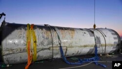 This photo provided by South Korea's Defense Ministry shows an object salvaged by South Korea's military that is presumed to be part of the North Korean space-launch vehicle that crashed into sea following a launch failure, in West Sea, South Korea, June 15, 2023.