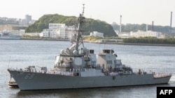 FILE - This US Navy photo shows the The Arleigh Burke-class guided-missile destroyer USS Milius (DDG 69) as it arrives at US Fleet Activities (FLEACT) Yokosuka on May 22, 2018 in Japan.